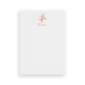 red coral classic notepad printed on White paper.