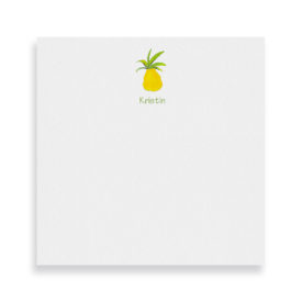 pineapple image adorns a square notepad printed on white paper.