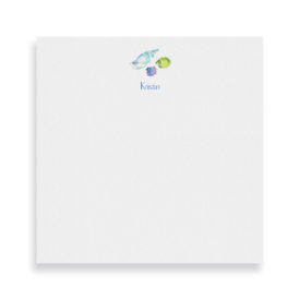 shells image adorns a square notepad printed on white paper.