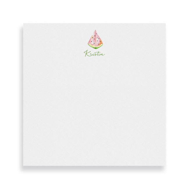 watermelon image adorns a square notepad printed on white paper.