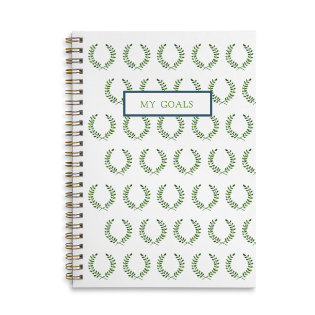 laurel wreath image adorns a spiral bound notebook with blank pages.
