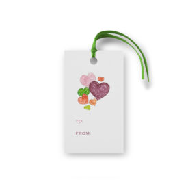 Hearts image on a gift tag that is glittered.