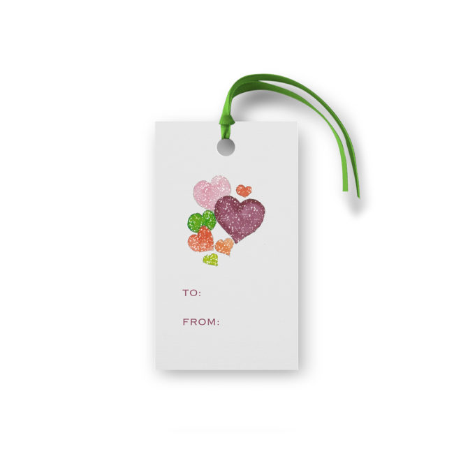 Hearts image on a gift tag that is glittered.