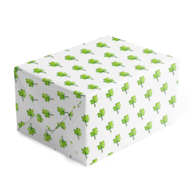Gift wrap on white paper featuring a green shamrock image.
